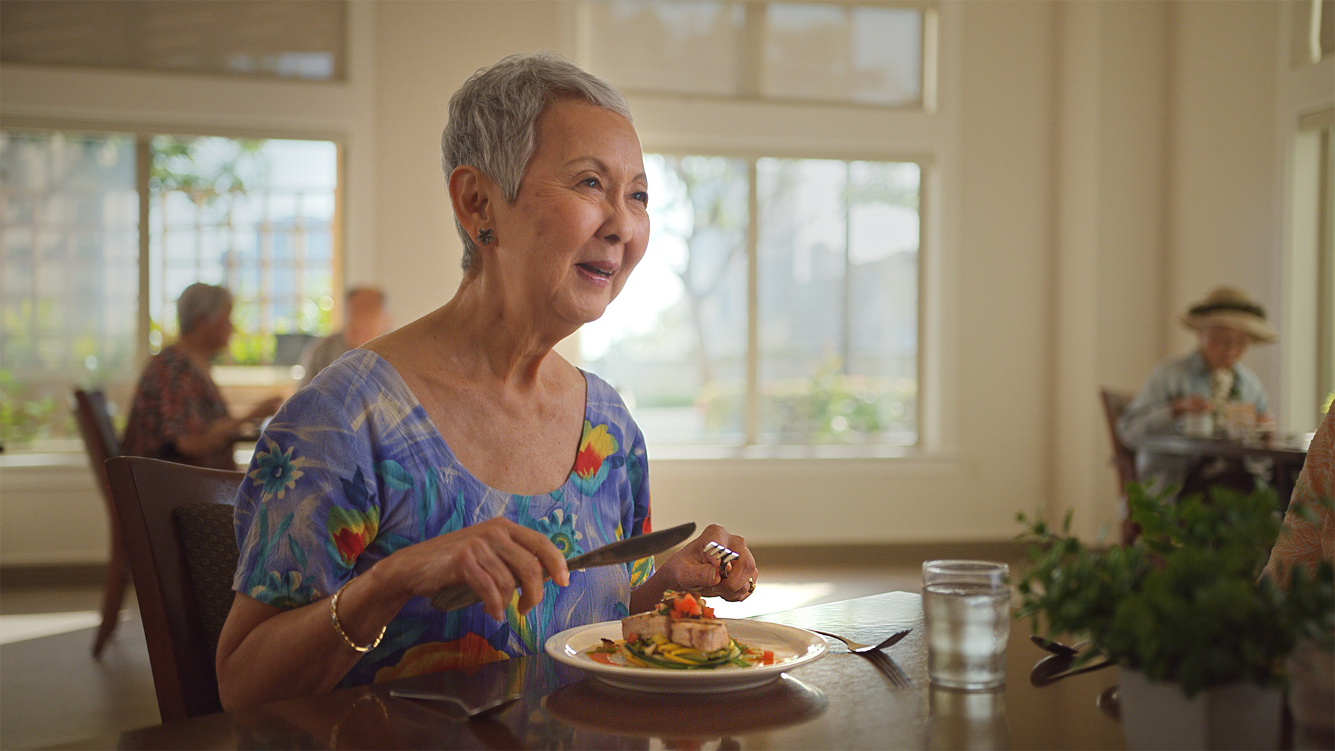 Resident enjoying a healthy meal at a local senior living community.