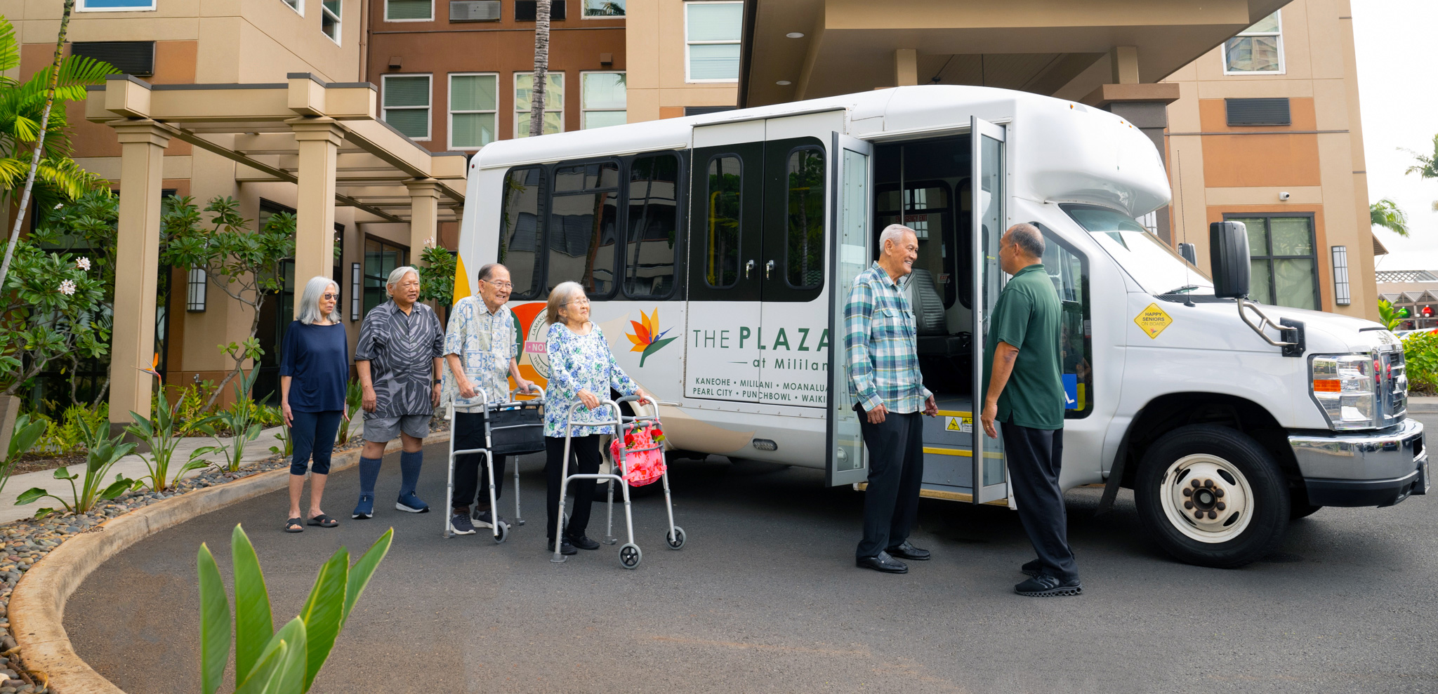 Residents boarding a shuttle bus for an outing at The Plaza Assisted Living.