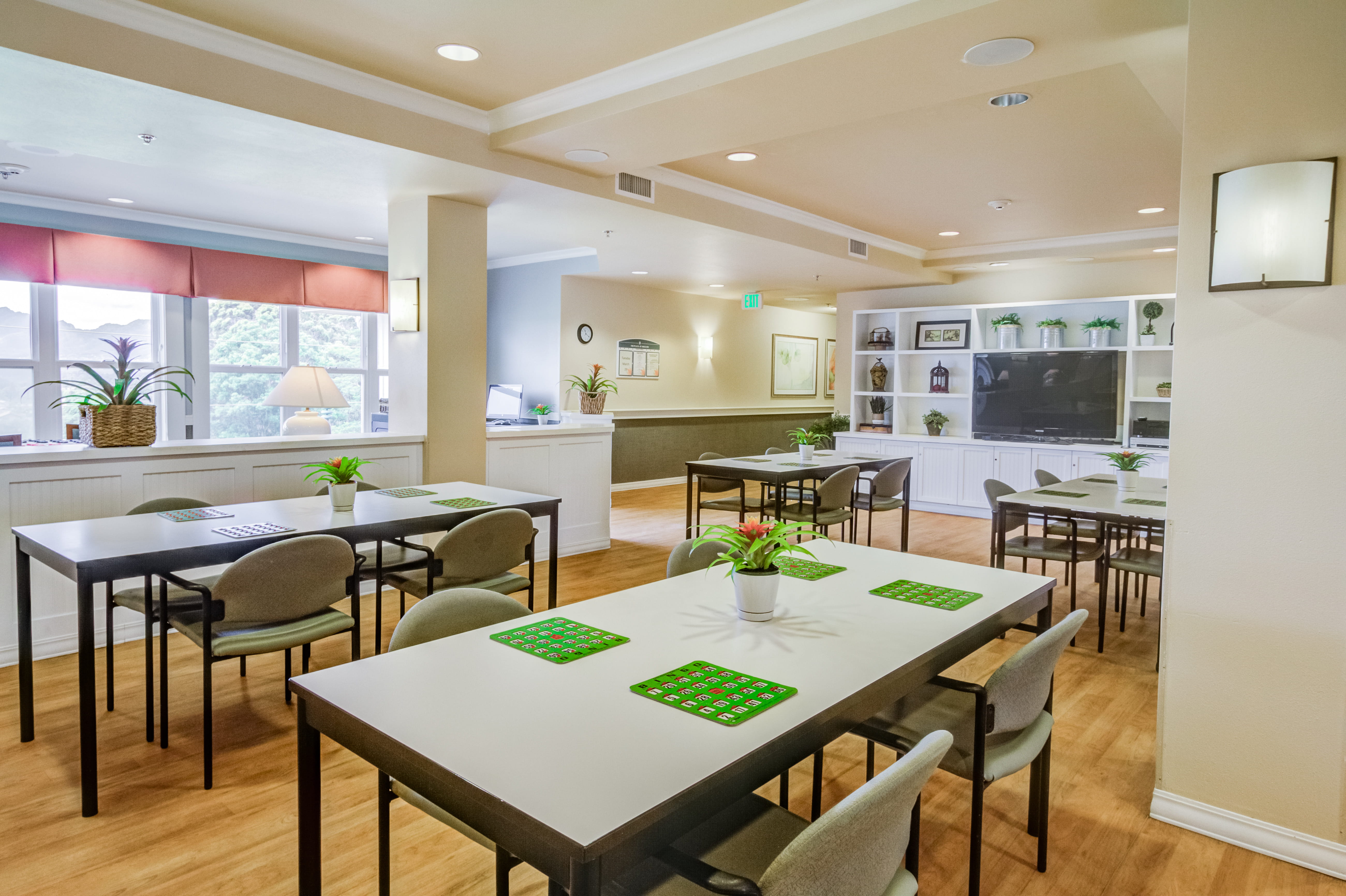 Large activity room set up for games at an assisted living facility.