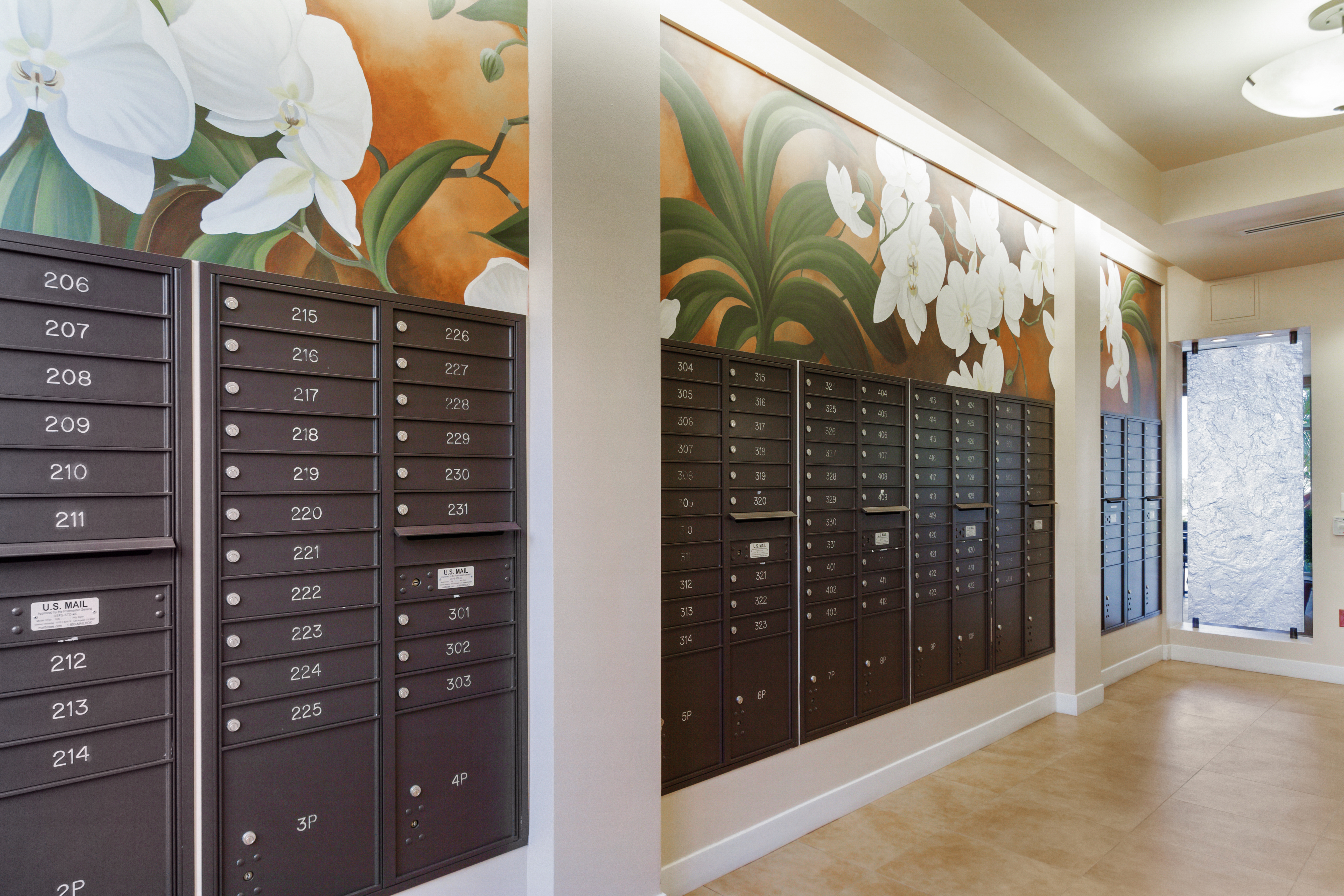 Mailbox area with orchid mural at a local senior living community.