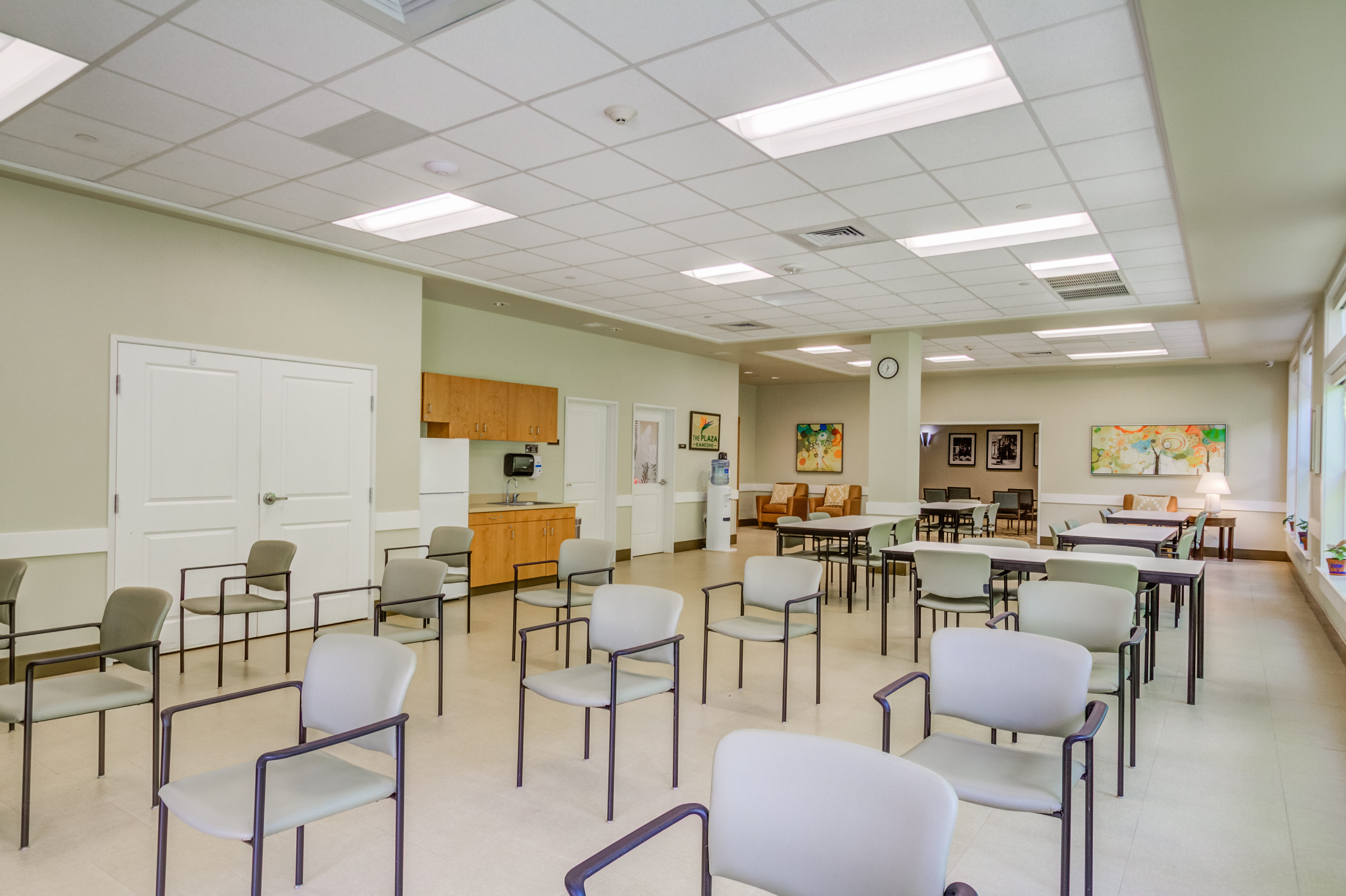 Spacious activity room with seating at The Plaza Assisted Living Kaneohe.