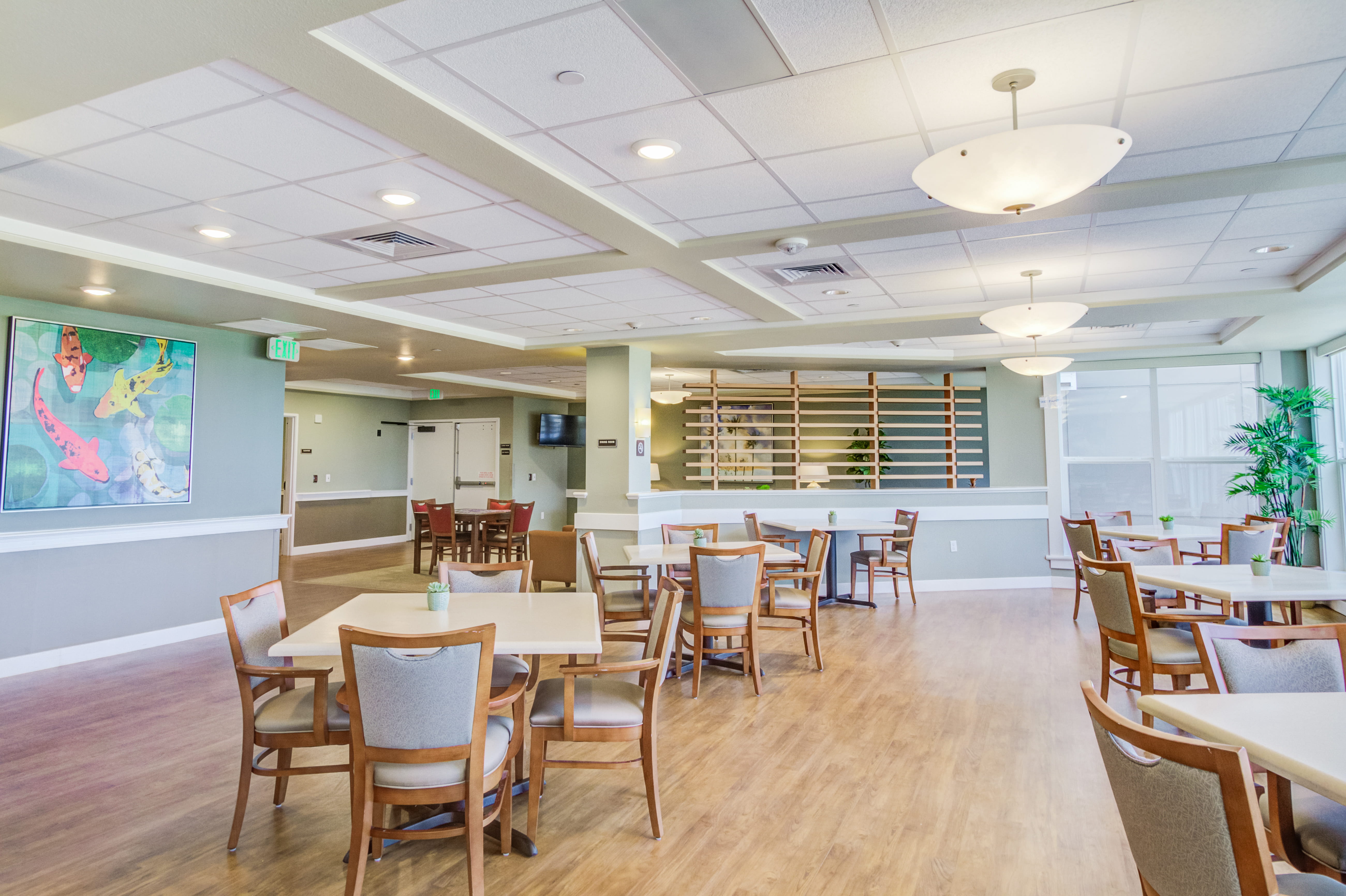 Large communal activity and dining space at The Plaza Assisted Living.