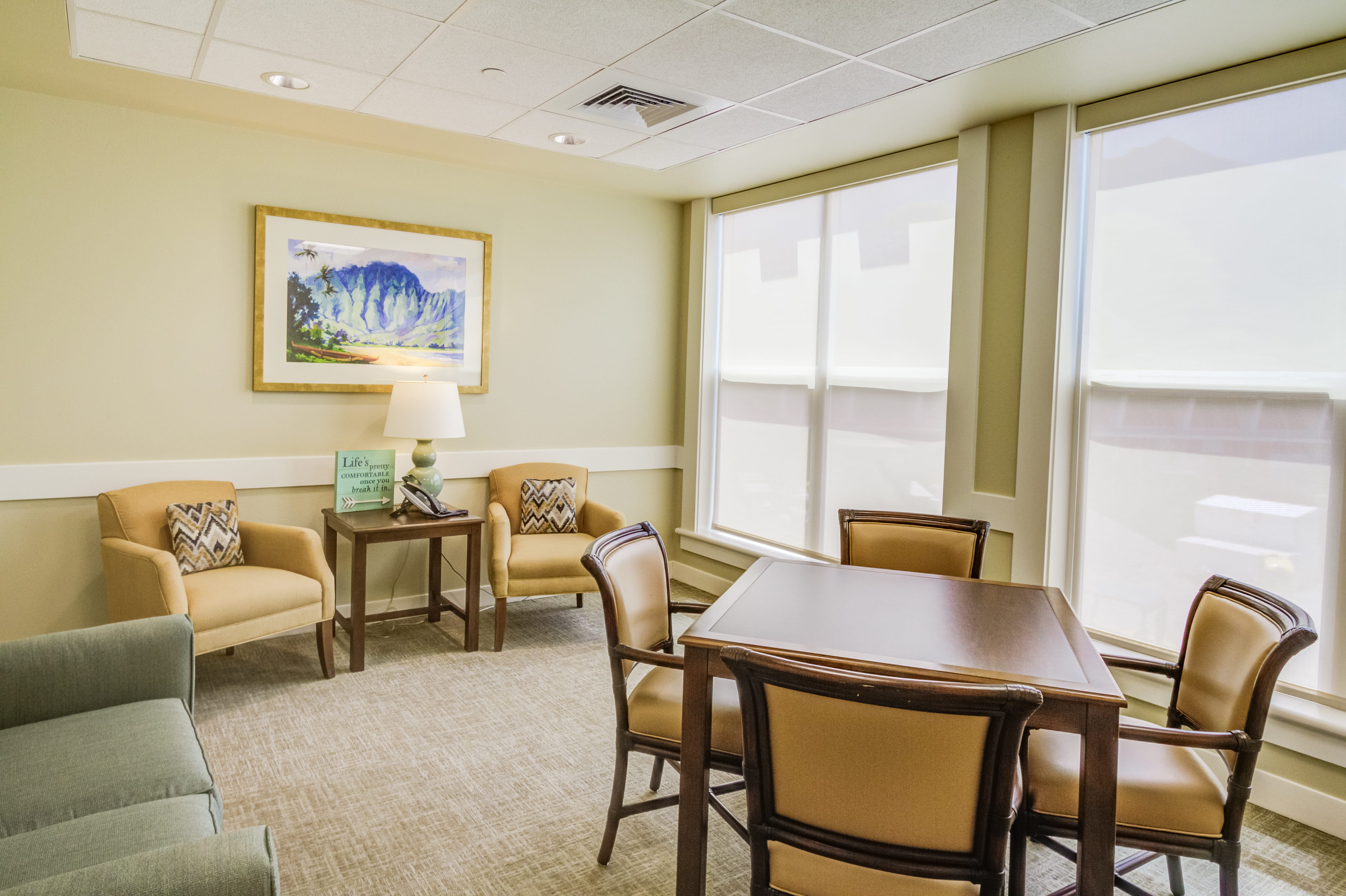 Quiet activity room with a card table at The Plaza Assisted Living.