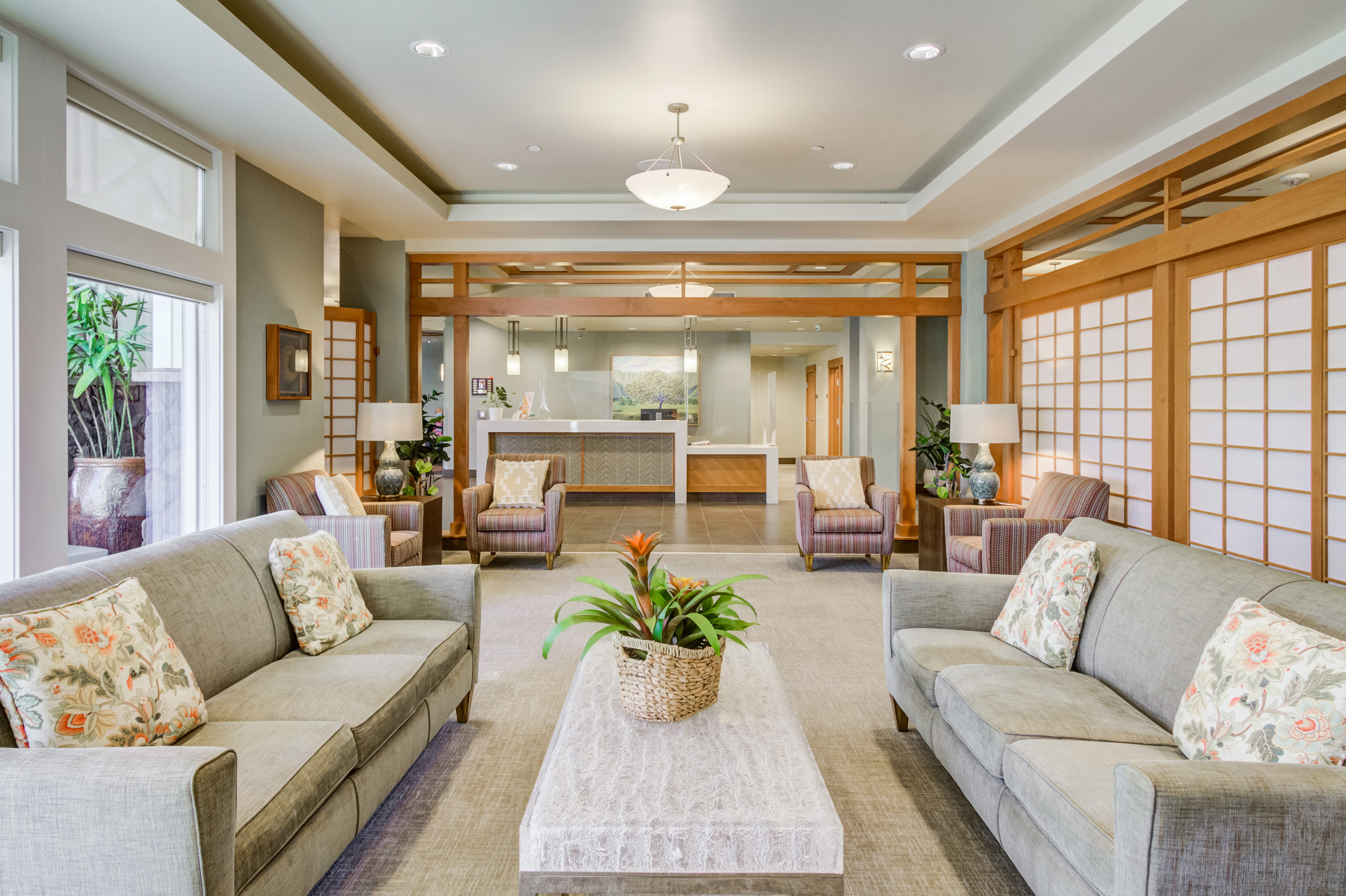 Modern lobby with comfortable couches and shoji-style dividers.